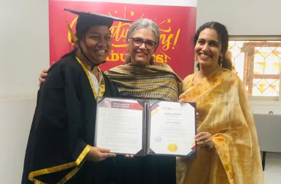 An FTTA graduate receiving her Diploma in Montessori Teacher Training