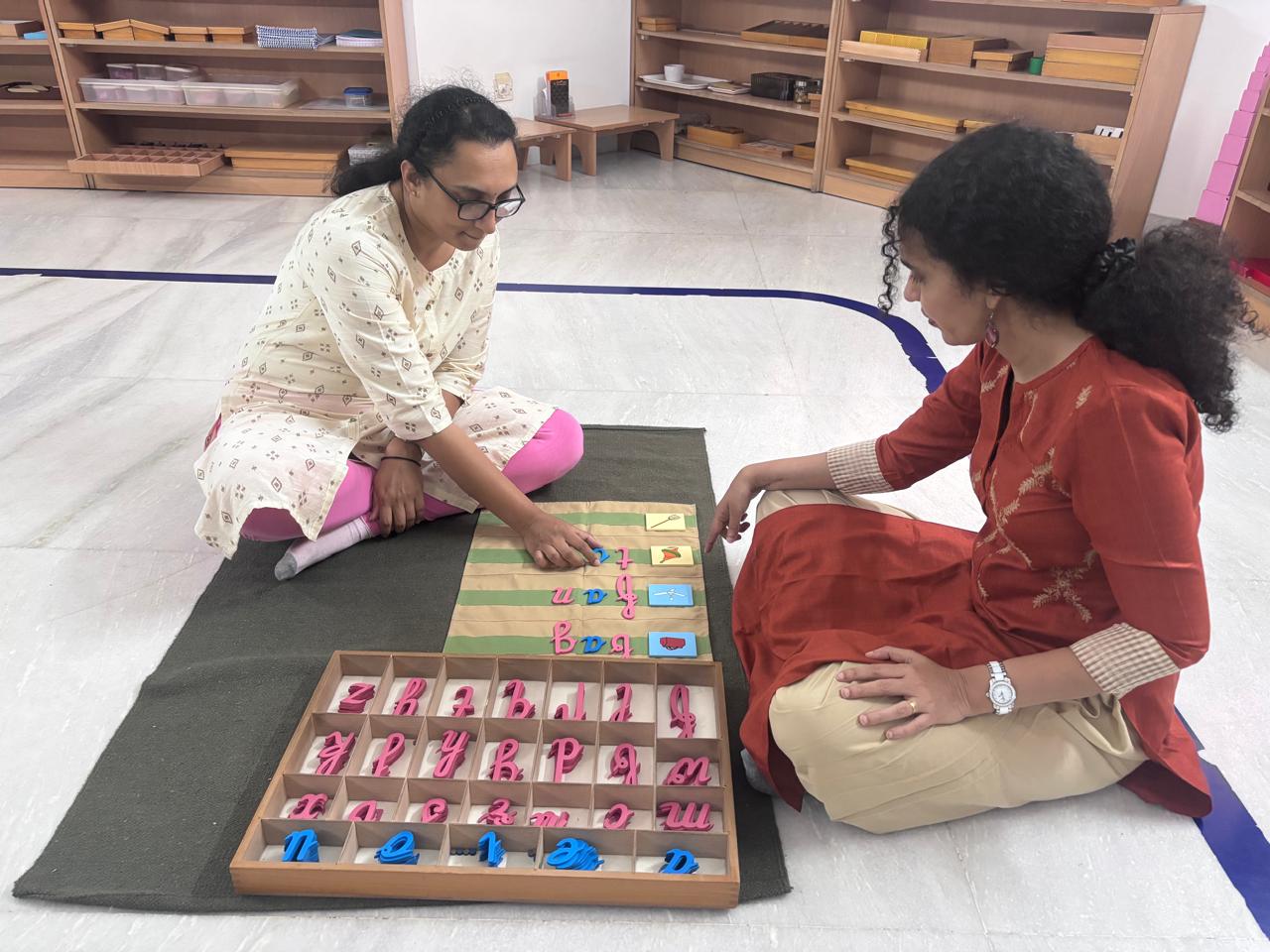 FTTA teacher trainer giving close support during bead board practice