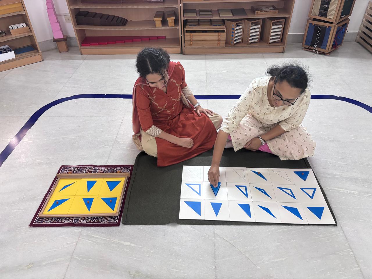 FTTA trainees comparing triangle control charts during Montessori practicals