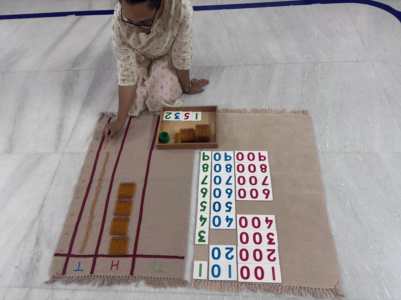 Montessori number rods and cards laid out for mathematics material practice
