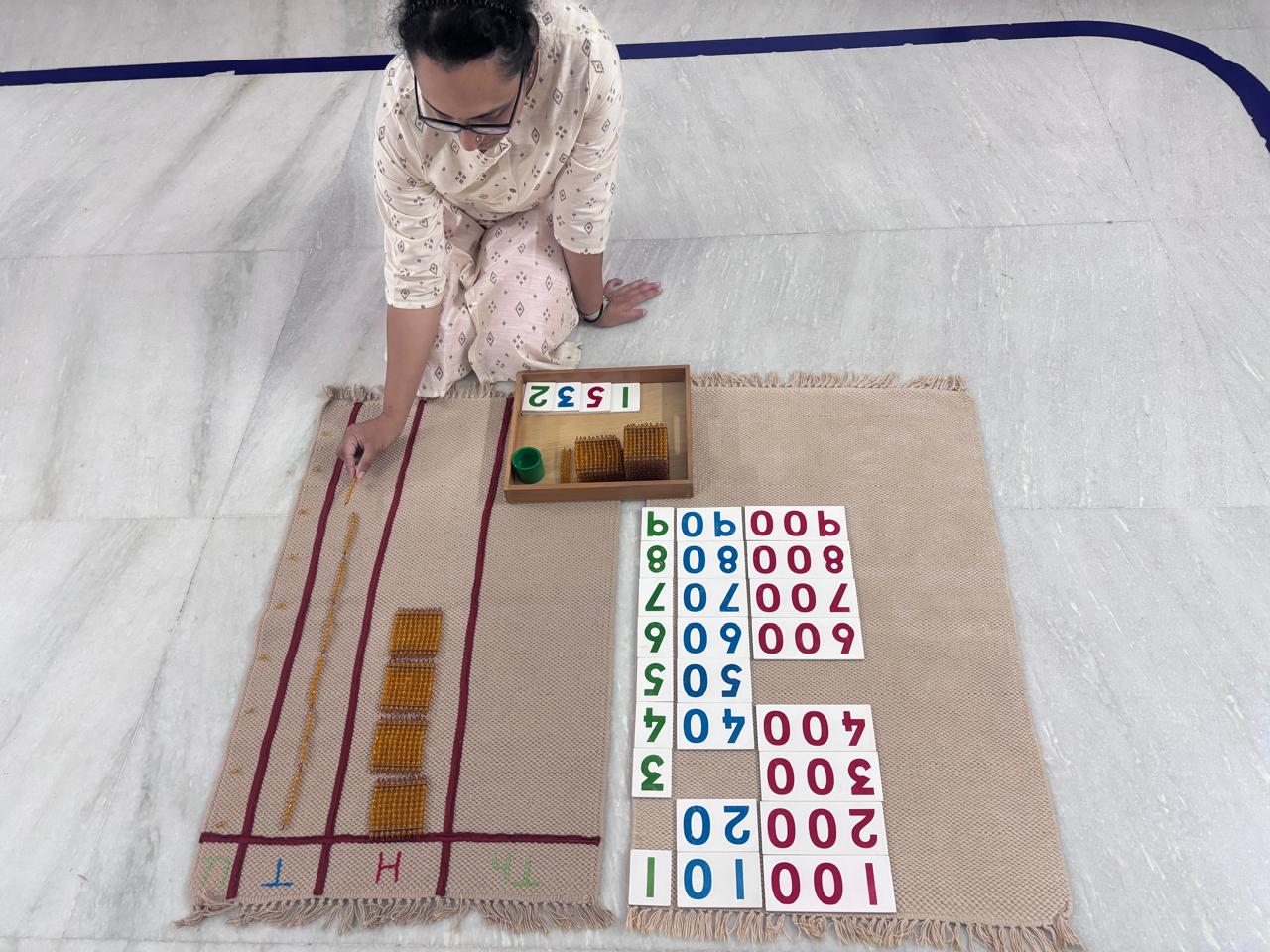 Montessori numerals and rods arranged for guided mathematics practice