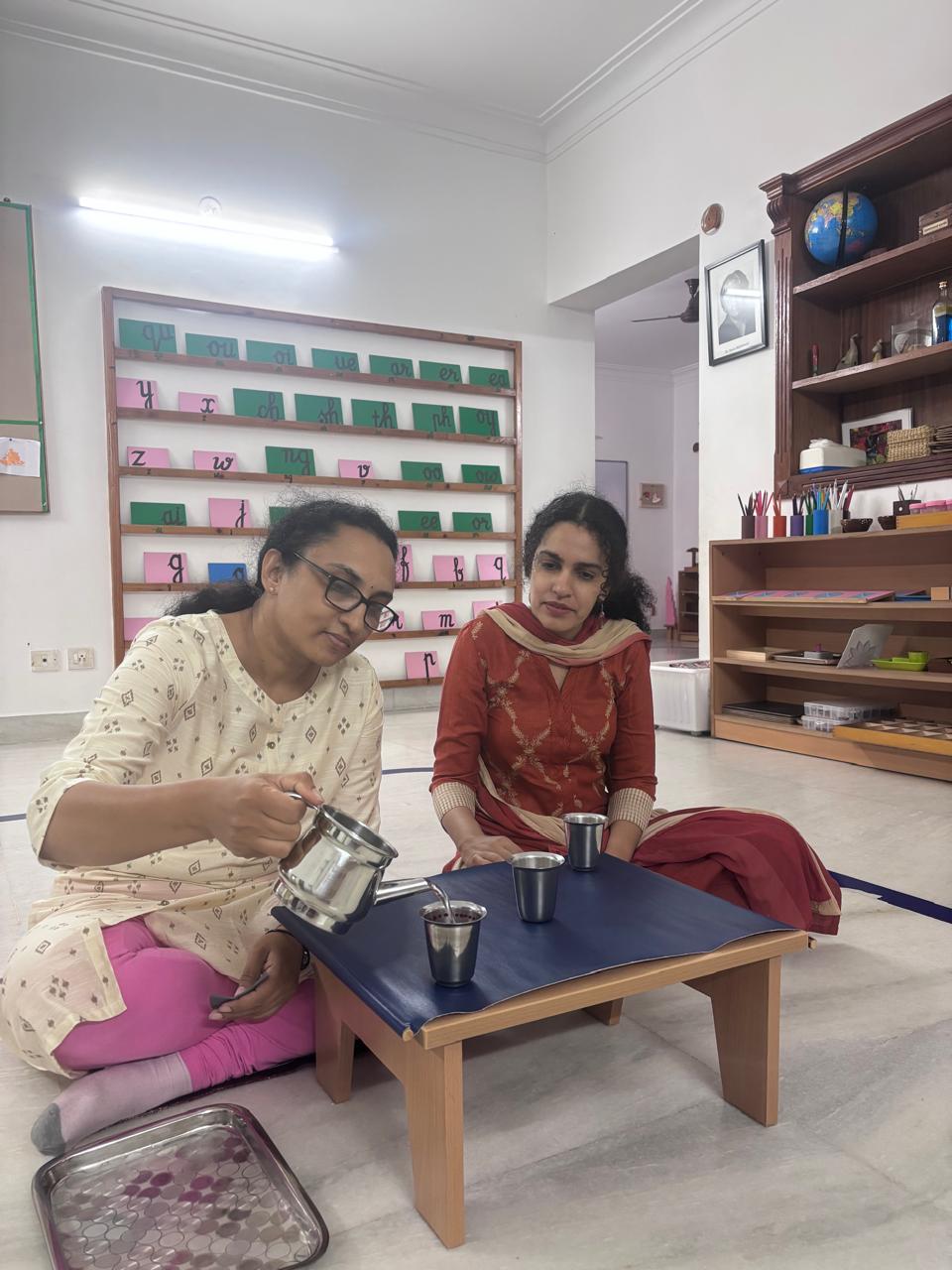 FTTA trainees using a tabletop Montessori material during guided training